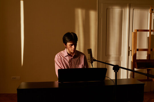 Young Musician Playing The Piano 
