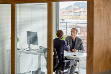 Client handshaking insurance company agent