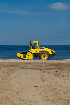 Yellow Soil Compactor On Beach