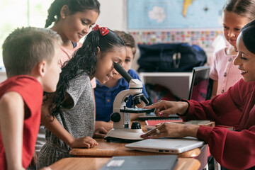 School: Students Gather To Learn Science With Microscope