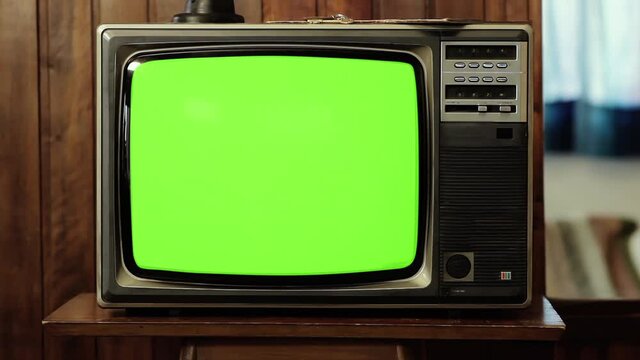 Vintage Television Set turning on Green Screen. Zoom Out. You can replace green screen with the footage or picture you want. You can do it with “Keying” effect in After Effects. 4K.