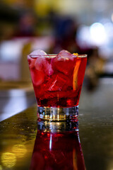 red drink with ice
classic cocktail glasses
drink in the club
caipirinha, negroni cold and in the...