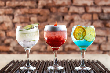 red, blue, white drink with ice
classic cocktail glasses
drink in the club
caipirinha, negroni cold and in the glass.
cocktails collection isolated on rustic background