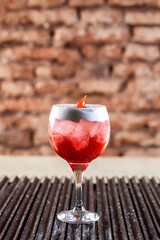 red drink with ice
classic cocktail glasses
drink in the club
caipirinha, negroni cold and in the...