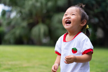 portrait of happy baby asian girl smile