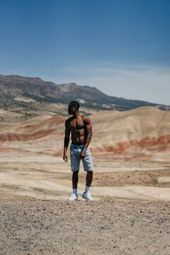 Portrait of a Black Man Standing With Beautiful View in Background
