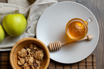 Eat the day with a healthy breakfast of honey muesli and apples