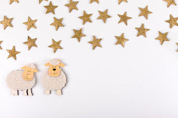 Feast of the Sacrif. Greeting card with wool lambs figures against a white background. Eid al-Adha Mubarak.Traditional Muslim holiday concept. Copy space.