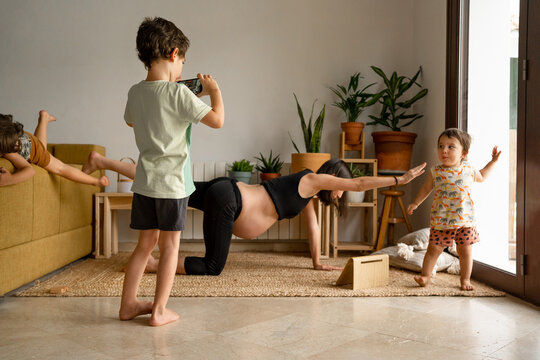 Pregnant mother doing yoga at home