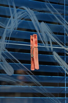  Clothespin in a blue shop window 
