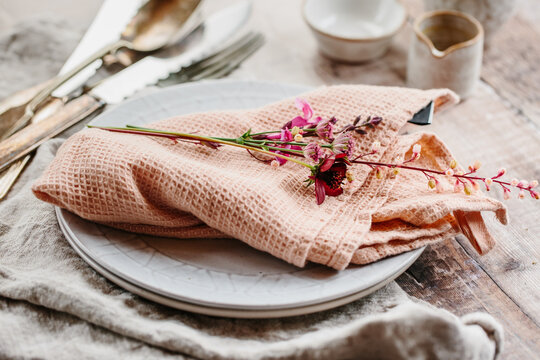 Ceramics, silver and pink flowers.