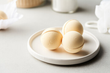 Aromatic bath bombs on plate in restroom