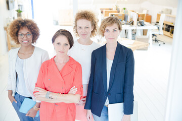 Portrait of women smiling in office