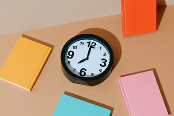 notepads and clock at eight
