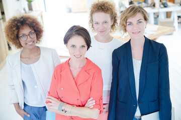Portrait of women smiling in office