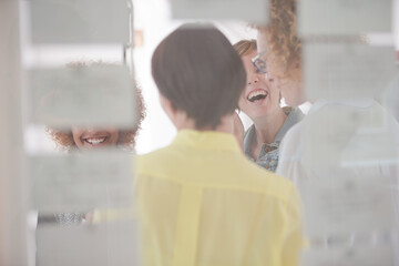 Women talking and smiling in office