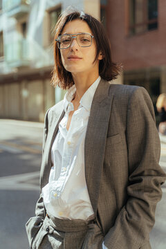 Serious woman in stylish suit in street
