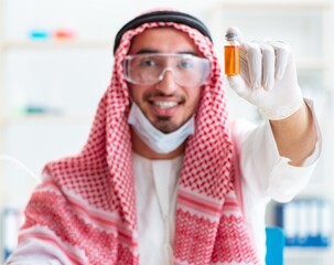 Arab chemist working in the lab office