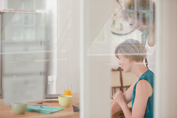 Women talking and smiling in office