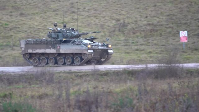 British army Warrior FV510 infantry fighting vehicle in action on military exercise, Salisbury Plain UK