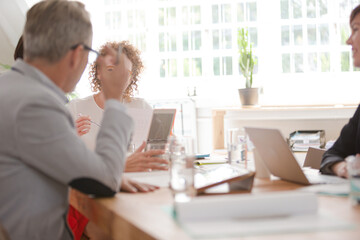 Office workers having meeting at desk