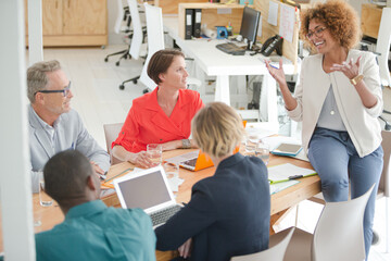 Office workers having meeting at desk