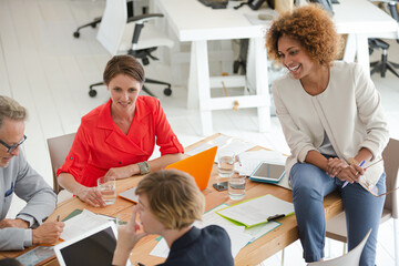 Office workers having meeting at desk