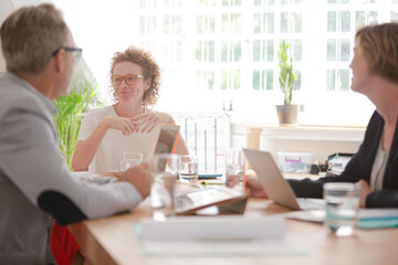 Office workers having meeting at desk