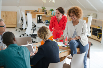 Fototapeta premium Office workers having meeting at desk