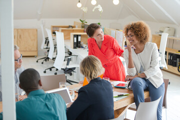 Office workers having meeting at desk