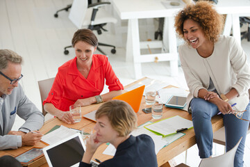 Office workers having meeting at desk