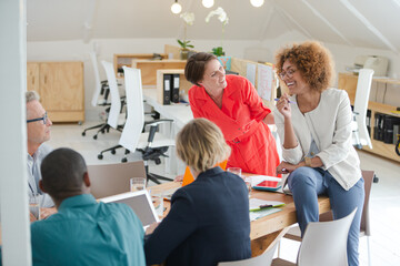 Office workers having meeting at desk