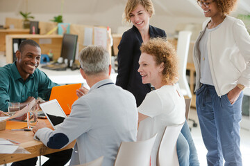 Fototapeta premium Office workers talking at desk