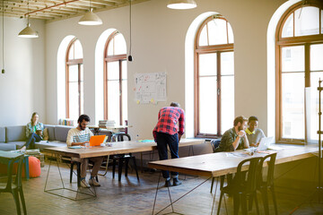 Casual businessmen and businesswomen meeting in office
