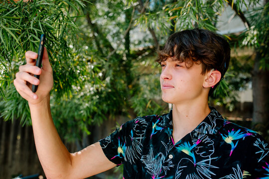 Handsome teen taking selfie