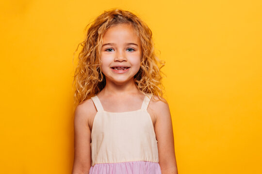 Little blonde girl portrait in studio