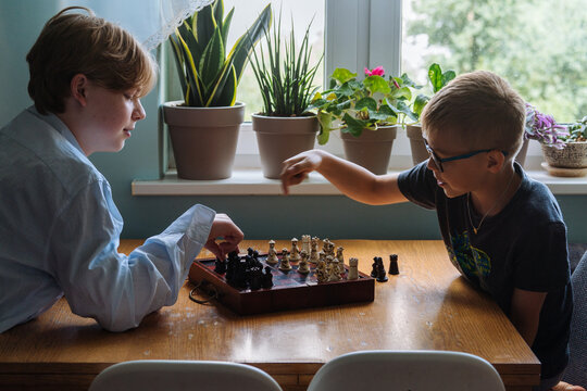 The boys are playing chess.