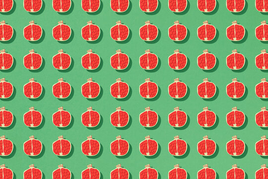 Pomegranate fruits seamless pattern and piece on green background