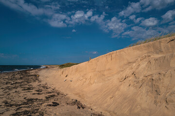 Eroded coastal sand dunes. The backdrop for severe weather, climate change, rising water, and erosion control themes.  