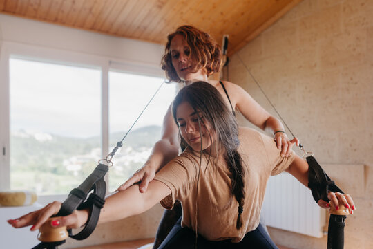 Women exercising together at home
