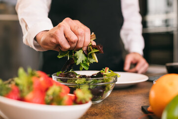 Crop chef pressing herbs 