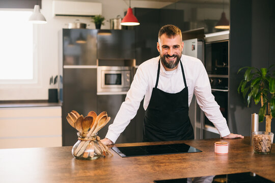 Confident chef standing in kitchen 