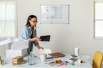 Woman Works at Packaging Station in Home Office