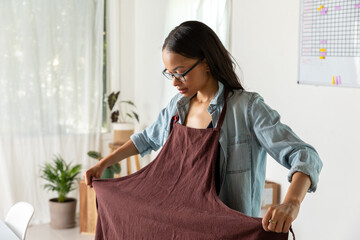 Woman Puts Apron On