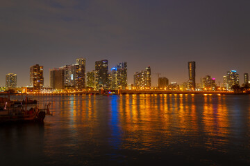 Naklejka premium Miami at sunset. Miami Florida, colorful skyline of Macarthur causeway.