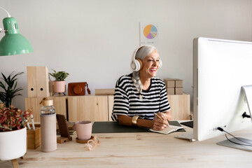 Mature woman working at workspace