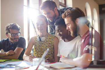 Creative business people brainstorming and working in office