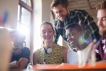 Creative business people brainstorming and working in office