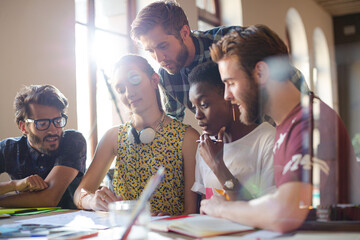 Creative business people brainstorming and working in office