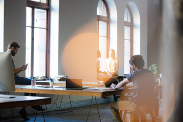 Casual business people working in open office